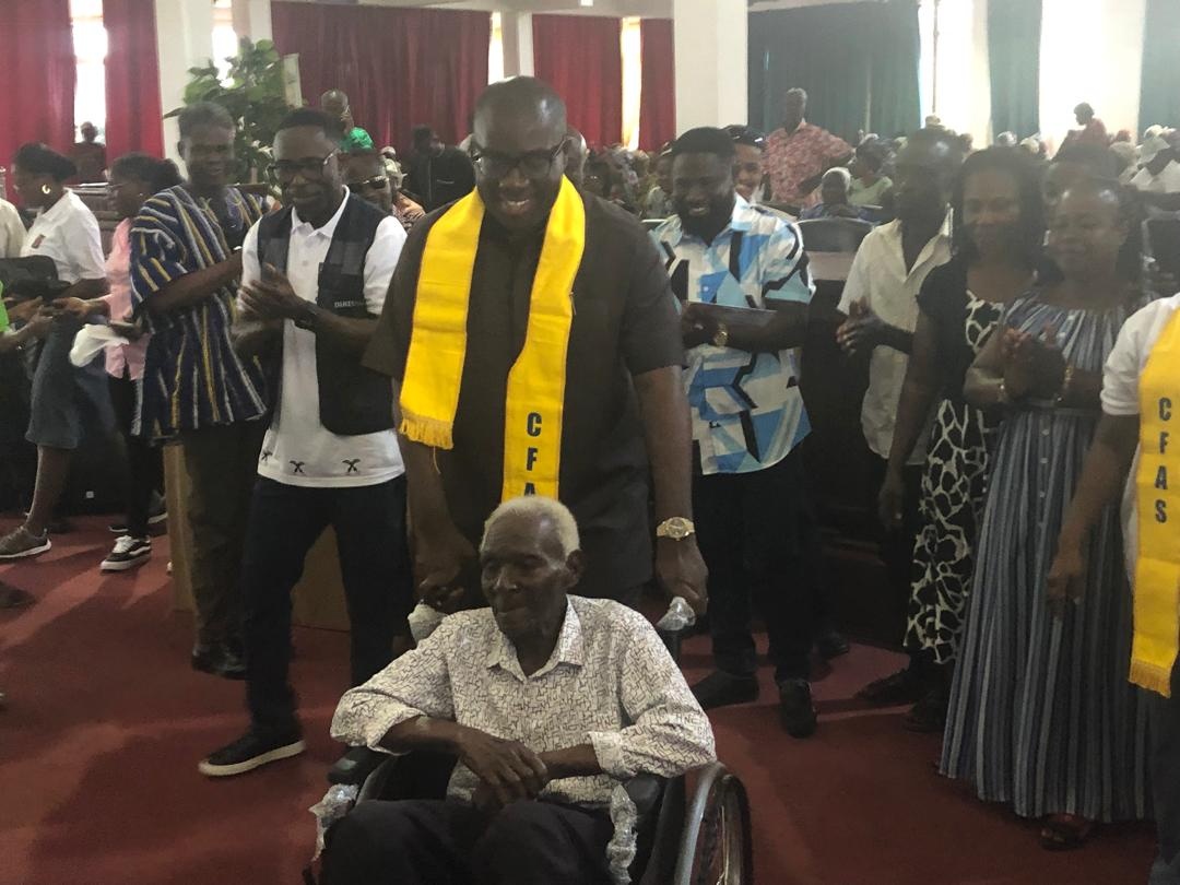 Sammy Awuku with an aged man
